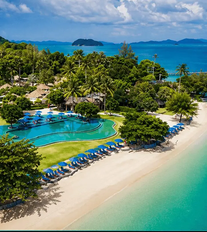 Naka Island from the air, with its beach, pool and palms