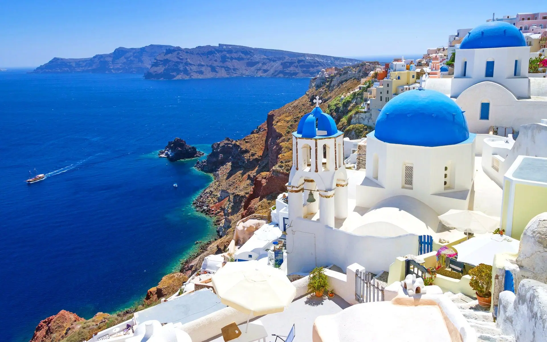 White houses and blue domes above the caldera at Oia, Santorini