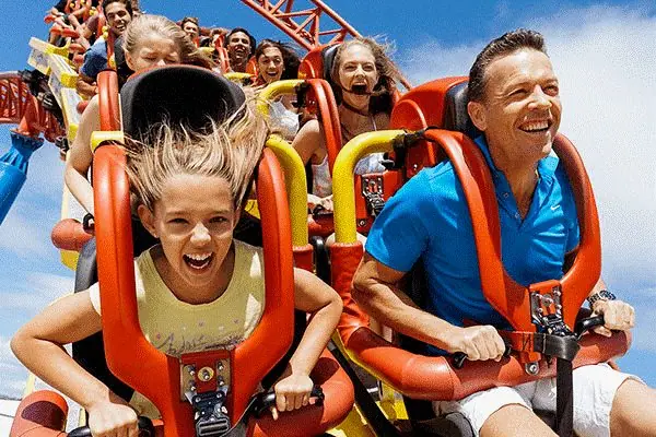 A family riding a roller coaster together