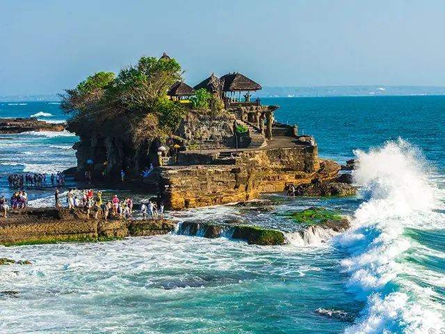 Waves breaking below the Tanah Lot sea temple in Bali